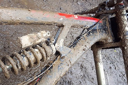 A muddy bike from a muddy course